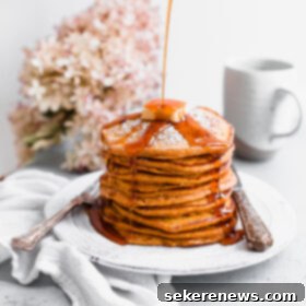 Fluffy Autumn Pumpkin Pancakes 8 Pumpkin Souffle Pancakes stacked and drizzled with maple syrup