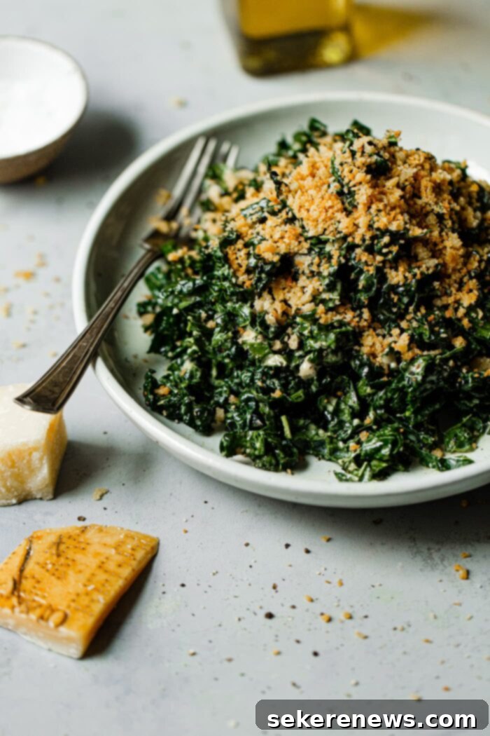 Signature Kale Caesar 2 Vibrant Kale Caesar Salad topped with golden crispy breadcrumbs and parmesan, ready to be served.