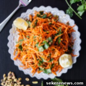 Vibrant Carrot and Pistachio Salad with Zesty Cilantro Dressing 7 Delicious Carrot Salad with Coriander Vinaigrette and Pistachios, elegantly plated