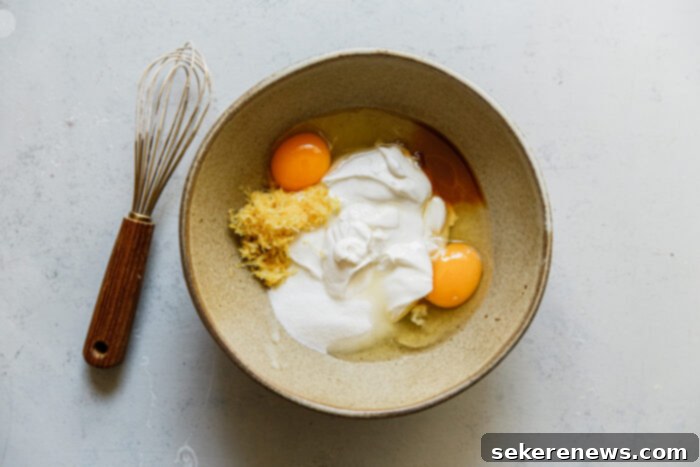 Pillowy Ricotta Doughnuts with Citrus Cardamom Sugar 7 Ricotta Donut Holes Wet Ingredients in Bowl