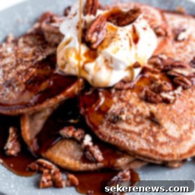 Spiced Pecan Buttermilk Stacks 5 Pecan Spiced Buttermilk Pancakes - a close-up shot of a stack with syrup and whipped cream