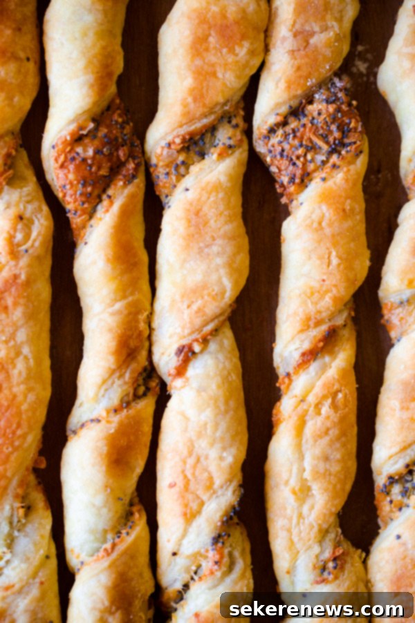 9 Everything Bagel Inspired Dishes 3 Crispy Everything Bagel Cheese Twists, perfect for a savory snack.