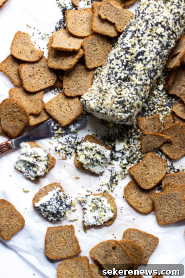 9 Everything Bagel Inspired Dishes 4 Creamy Everything Bagel Goat Cheese log, ideal for spreading.