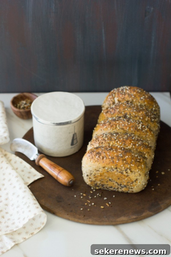 9 Everything Bagel Inspired Dishes 7 Freshly baked Everything Bagel Bread loaf, sliced and ready to eat.