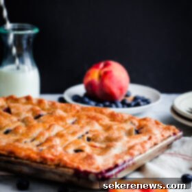Homestyle Blueberry Peach Slab Pie 7 Blueberry Peach Slab Pie. The ultimate summer dessert!