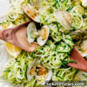 Garlic Clam Zoodles 2 Zucchini Linguini with Garlic Clam Sauce. An EASY, healthy dinner recipe made with zucchini noodles. Less than 250 calories per serving!