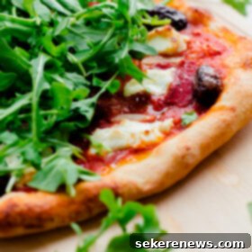 Goat Cheese Pizza with Chili, Olives, and Arugula 6 Spicy Red Pepper, Goat Cheese, Olive, and Arugula Pizza