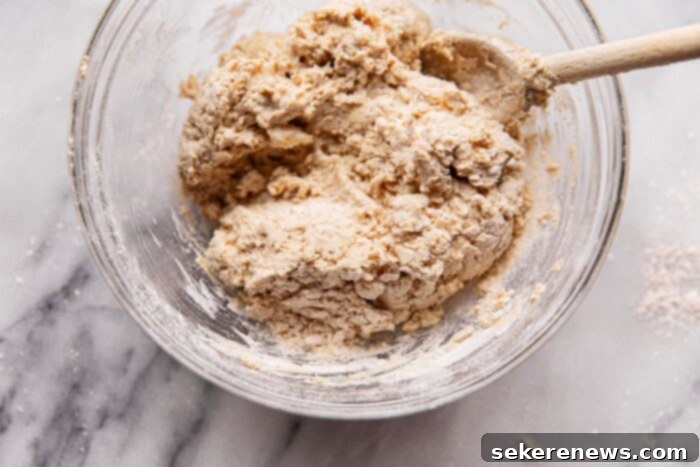 Effortless Whole Wheat Biscuits 9 Kneading biscuit dough on a floured surface