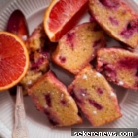 Almond Raspberry Mini Cakes 2 A beautifully decorated Small Batch Almond Raspberry Cake, topped with a vibrant pink glaze.