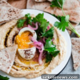Hummus with Jammy Egg, Pickled Onion, Fresh Parsley and Sumac Drizzle 7 Hummus with Soft Boiled Egg, Pickled Onion, Parsley, and Sumac Oil