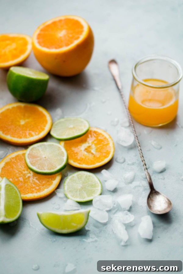 Tropical Ginger Zinger 5 Sliced Oranges and Lime Pieces with Ice