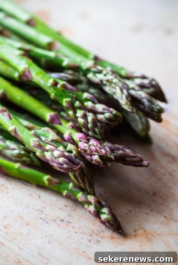 Perfect Asparagus Every Time 6 Close-up of vibrant Purple Tipped Green Asparagus spears