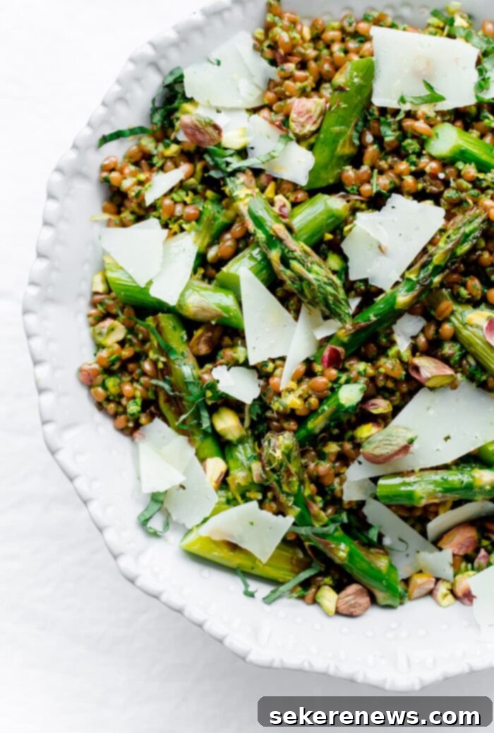 Perfect Asparagus Every Time 7 Asparagus Grain Salad with fresh vegetables in a white bowl