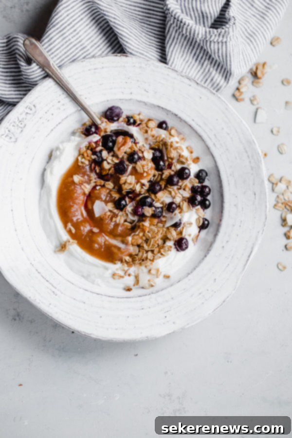 Instant Pot Apple Sauce - this EASY pressure cooker apple sauce recipe contains zero added sugar, requires zero peeling, and can be made in less than 30 minutes! Serve it with Greek yogurt and granola for a healthy breakfast. #instantpot #applesauce #apple Instant Pot Apple Sauce