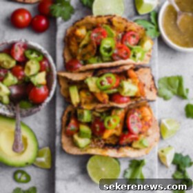 Spicy Mumbai Shrimp Tacos with Creamy Avocado Salsa 8 Mumbai Shrimp Tacos with Avocado Salsa - this EASY shrimp taco recipe is packed with spice and topped with a simple avocado tomato salsa!