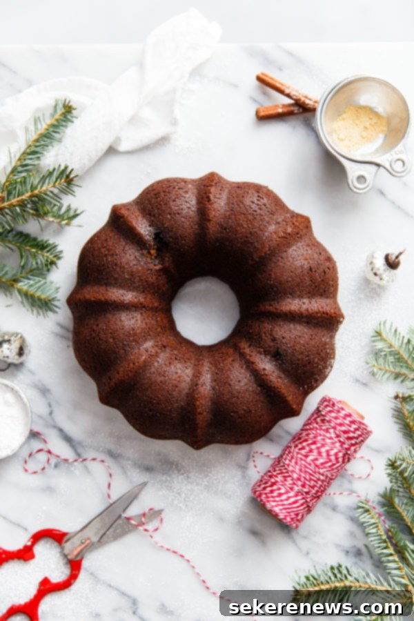 Holiday Gingerbread Bundt with Velvety Eggnog Cream 3 Overhead shot of the Gingerbread Bundt Cake showing its intricate design and golden crust, ready to be sliced for a holiday gathering.