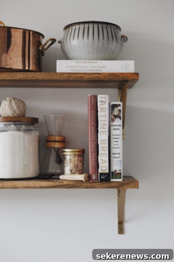 Essential Sourdough Bread Cookbooks and Learning Resources for Home Bakers An open kitchen shelf showcasing a collection of essential bread baking books and valuable resources