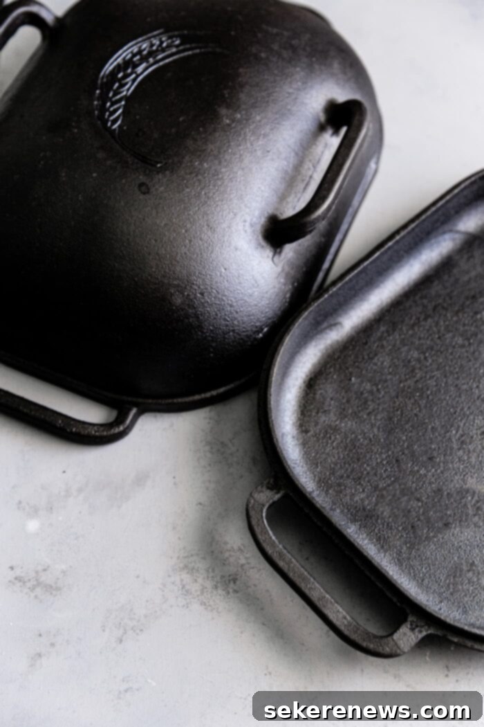 Sourdough Success: Essential Tools and Guides 6 The open Challenger Bread Pan, showcasing its spacious cast iron interior and functional handles
