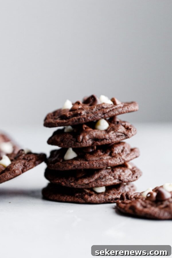 Perfectly stacked triple chocolate cookies, a delightful dessert. Stacked Triple Chocolate Cookies showing their rich color and texture