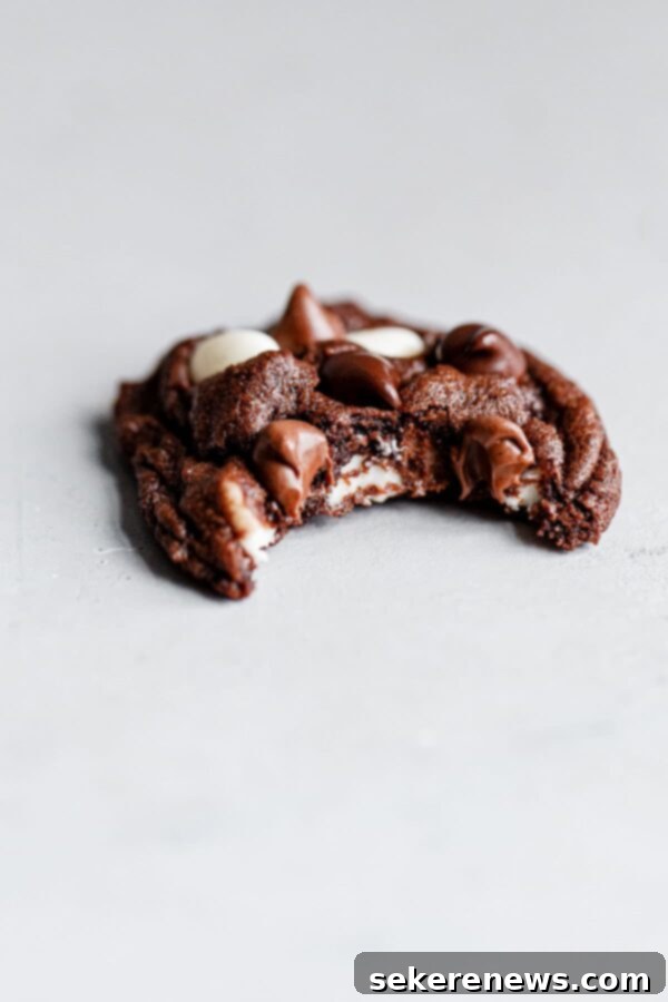 Triple Chocolate Dream Cookies 3 Close-up of a Bitten Triple Chocolate Cookie Showcasing its Interior