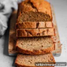 Simple Wholesome Banana Bread 4 A slice of Easy Healthier Banana Bread, showcasing its moist texture.