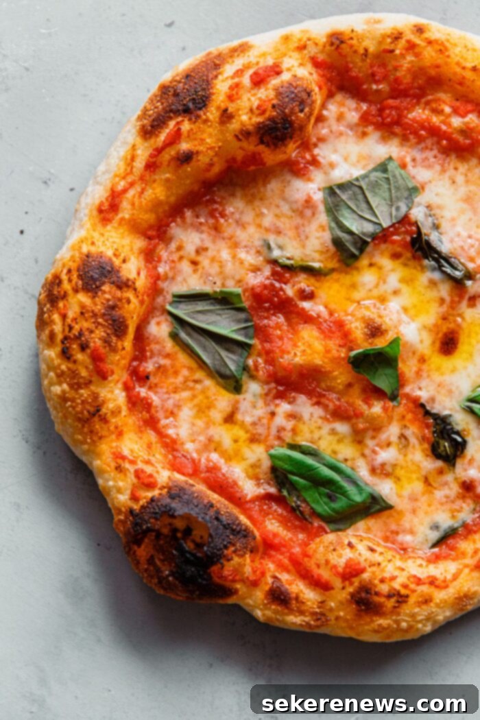 Perfect Sourdough Pizza Dough 17 Baked Sourdough Pizza with Mozzarella Tomato and Basil