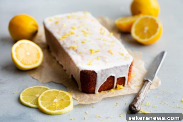 Zesty Lemon Pound Cake 8 A freshly baked and glazed lemon loaf cake resting on a wire rack, allowing the glaze to set beautifully, ready for serving or storage.
