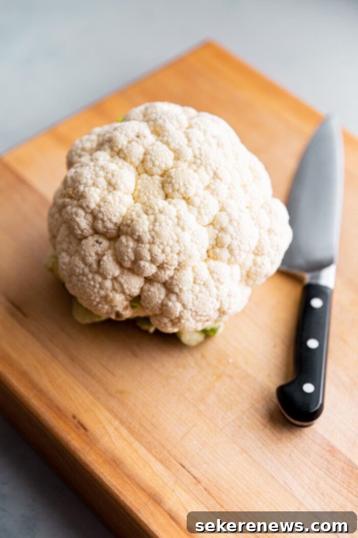 Golden Spiced Cauliflower 3 Whole Head of Cauliflower on Cutting Board