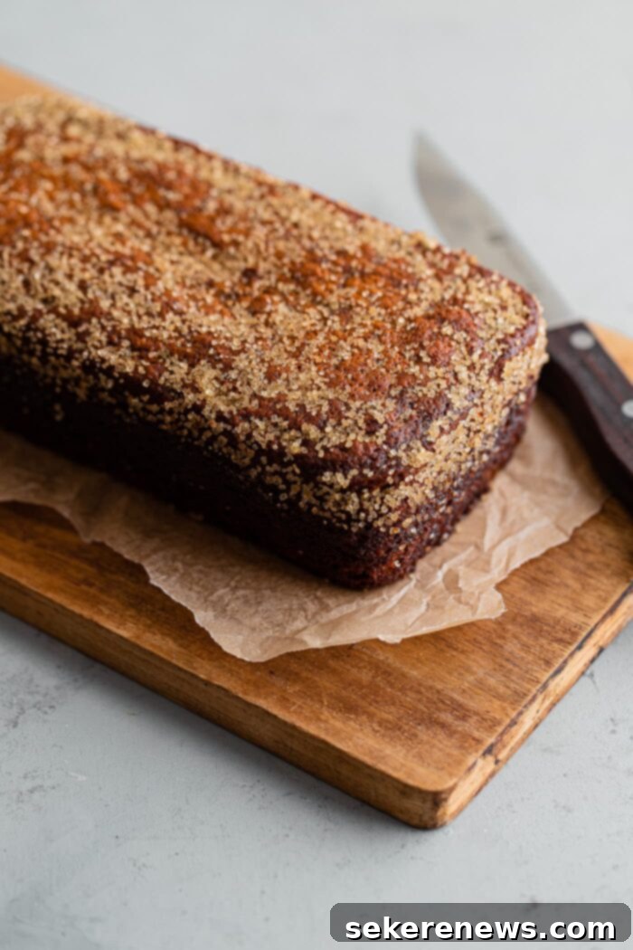 Ultimate Moist Banana Bread 10 Freshly Baked Moist Banana Bread on a Wooden Cutting Board