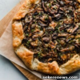 Woodland Mushroom Tart 4 Mushroom Galette with Blue Cheese on Cutting Board