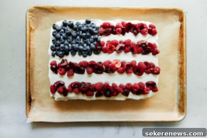 Patriotic Pride Cake 13 Finished American Flag Cake with berries and whipped cream.